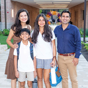 Photo of parents and their two kids. Links to Donor-Advised Funds