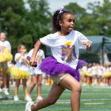 A girl running. Links to Gifts of Real Estate