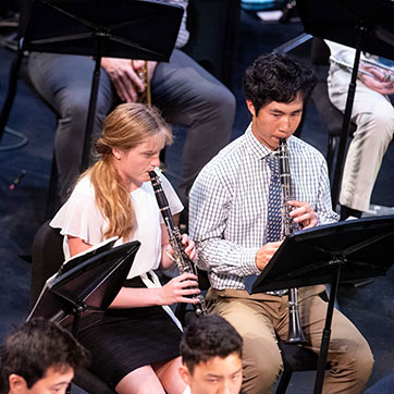 Students playing an instrument. Links to Gifts by Will