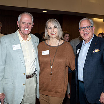 Three people smiling. Links to Gifts of Cash, Checks, and Credit Cards